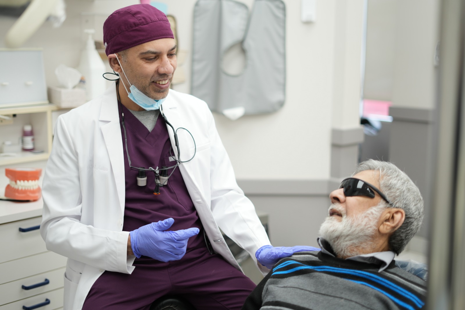 Dr. Jasdeep Singh Ashta with patient - 24/7 emergency Dentist